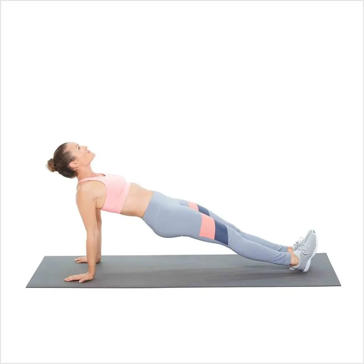 Person performing Arch Hold (Reverse Plank), a bodyweight exercise for back strength, with hips lifted and body in a straight line.