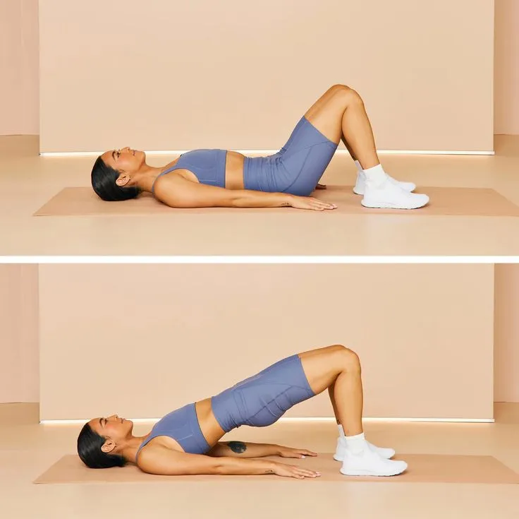 Person demonstrating Hip Bridges, a bodyweight exercise for back strength, lying on a mat with hips lifted and knees bent.