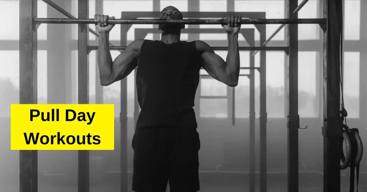 Man performing pull-ups during pull day workout to build back and biceps strength.